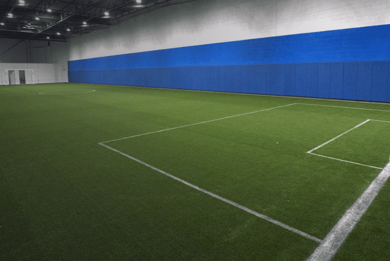 Kids playing on indoor turf